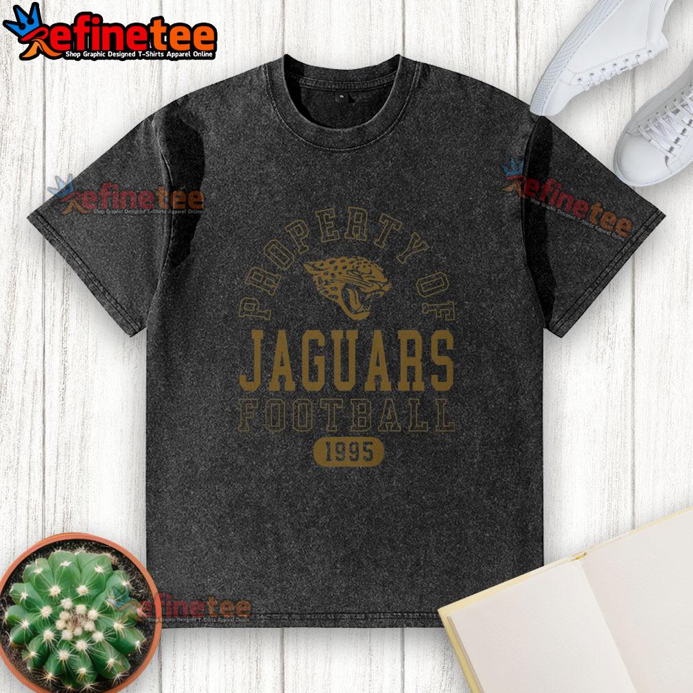 premium-jacksonville-jaguars-football-property-1995-washed-t-shirt Alt Text: Premium Jacksonville Jaguars Football Property 1995 washed t-shirt featuring team logo and vintage design.