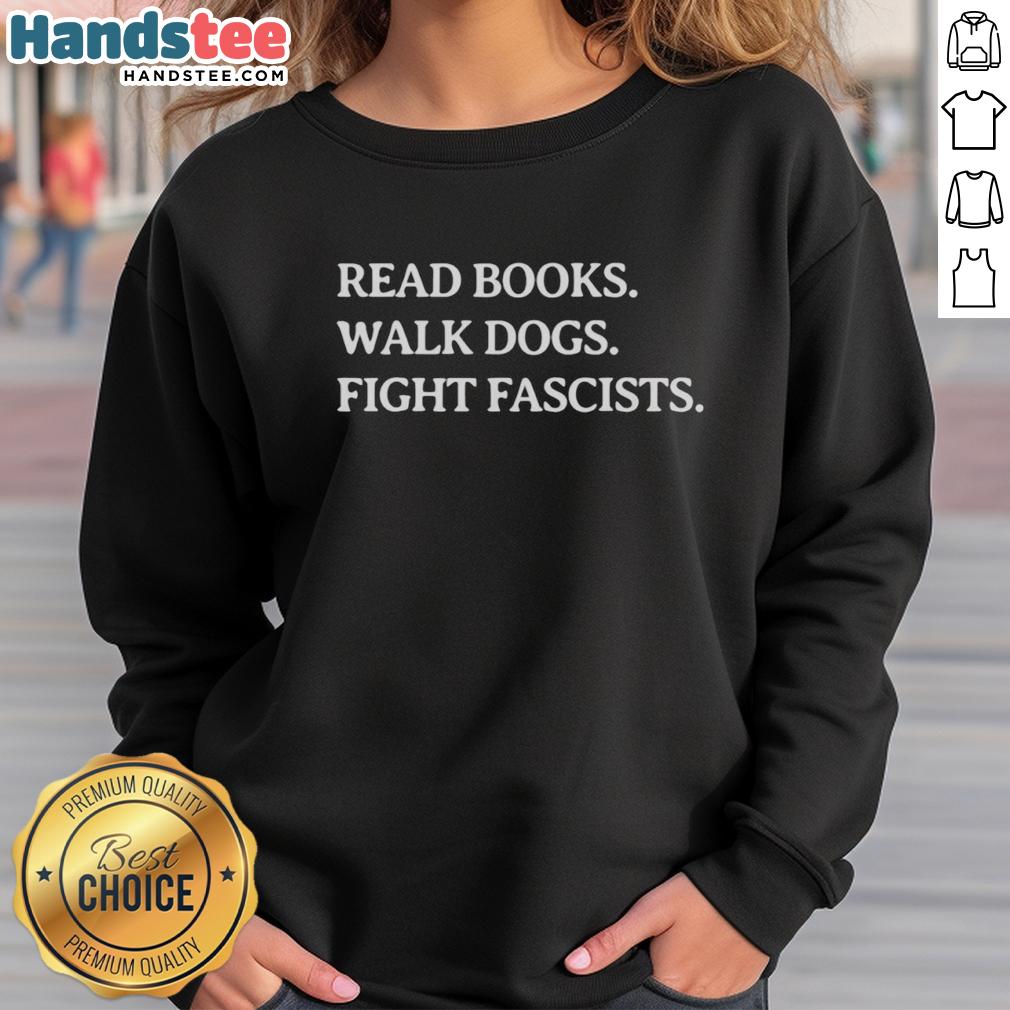 premium-read-books-walk-dogs-fight-fascists-sweatshirt Premium Read Books Walk Dogs Fight Fascists Sweatshirt in a cozy, casual setting, perfect for book lovers and activists.