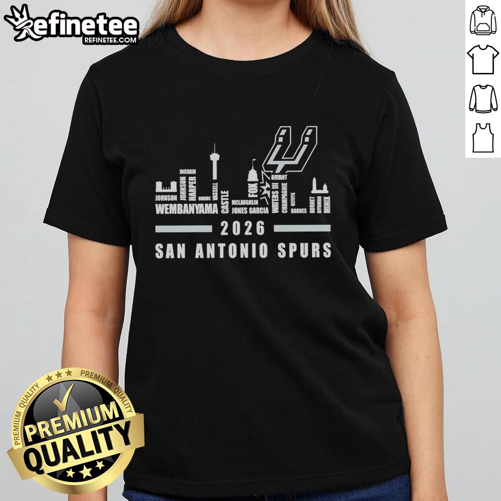 premium-san-antonio-spurs-nba-2026-name-player-city-skyline-ladies-tee Alt Text: Premium San Antonio Spurs NBA 2026 ladies tee featuring player names and city skyline design.
