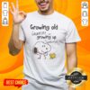 Alt Text: Premium Snoopy and Woodstock T-shirt featuring 'Growing Old Is Mandatory But Growing Up Is Optional' design.