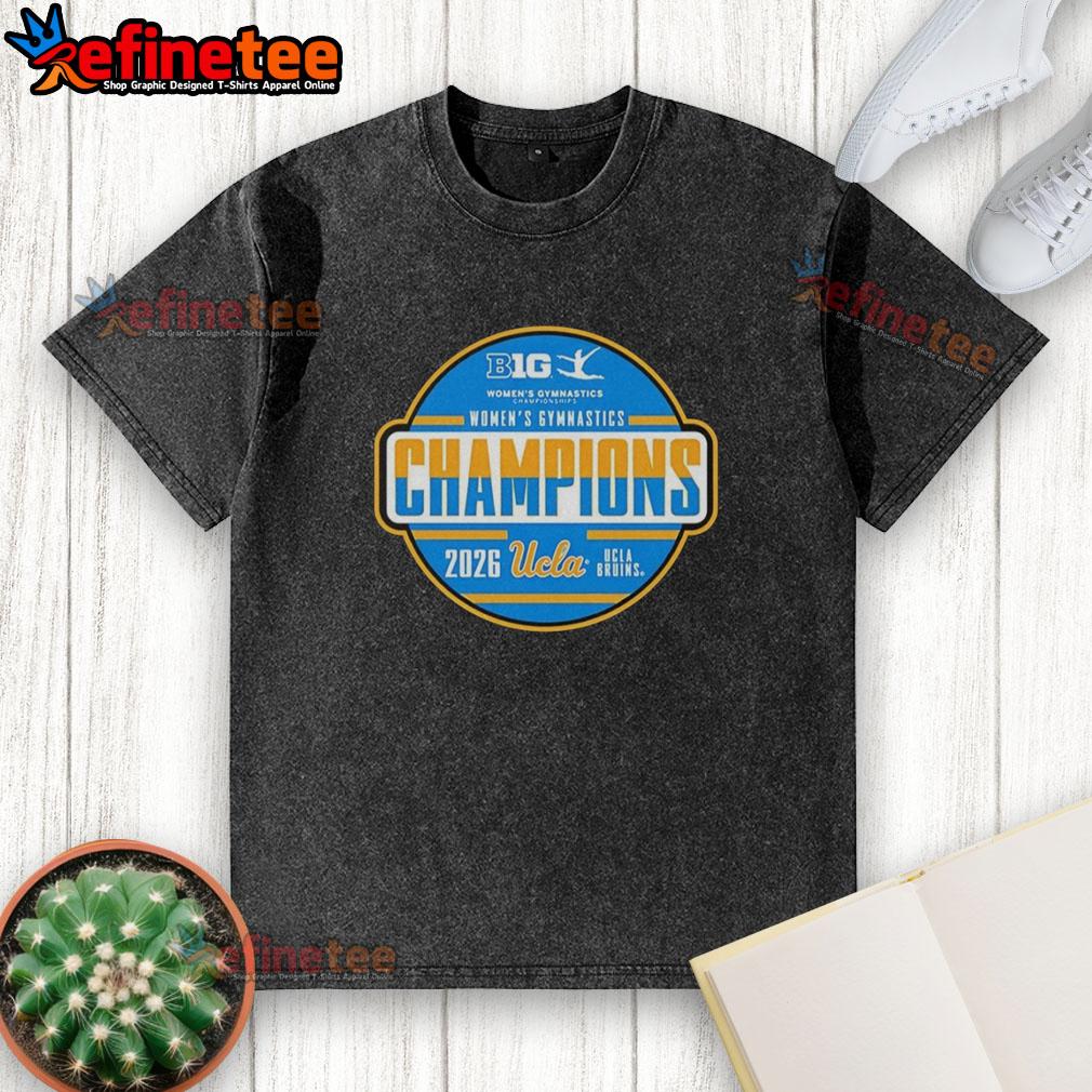 premium-ucla-bruins-big-ten-womens-gymnastics-tournament-champions-washed-t-shirt Alt Text: Premium UCLA Bruins Big Ten Women's Gymnastics Tournament Champions washed t-shirt displayed on a wooden background.