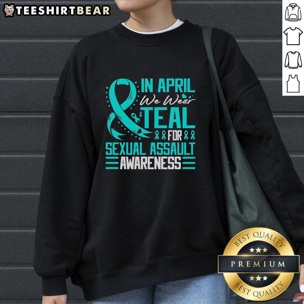 pretty-in-april-we-wear-teal-for-sexual-assault-awarenesse-blue-ribbon-sweatshirt Alt Text: Teal sweatshirt with Pretty in April design for Sexual Assault Awareness, featuring a blue ribbon symbol.