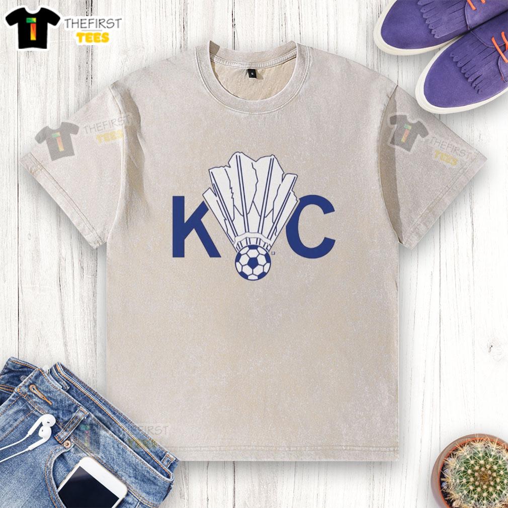 pretty-kc-soccer-shuttlecock-logo-washed-t-shirt Alt Text: Pretty KC Soccer Shuttlecock Logo on a Washed T-Shirt, showcasing a trendy design for sports enthusiasts.
