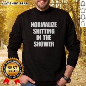 Trendy 'Top Normalize Shitting In The Shower' sweatshirt in a casual setting, perfect for humor and comfort lovers.