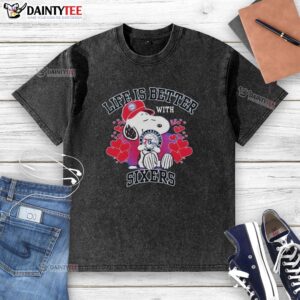 Alt Text: Snoopy wearing a Philadelphia 76ers logo t-shirt with Life Is Better With Sixers design, perfect for fans.