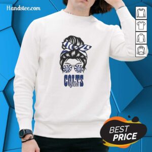 Cheerful Indianapolis Colts girl in a messy bun, wearing glasses and a cozy sweatshirt, showcasing team spirit.