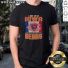 Alt Text: Chicago Bears football flag t-shirt with 'I May Live In Iowa But My Heart Belongs To Chicago Bears' slogan.