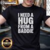 Top I Need A Hug From A Baddie T-Shirt in black with bold white text, perfect for stylish and fun casual wear.