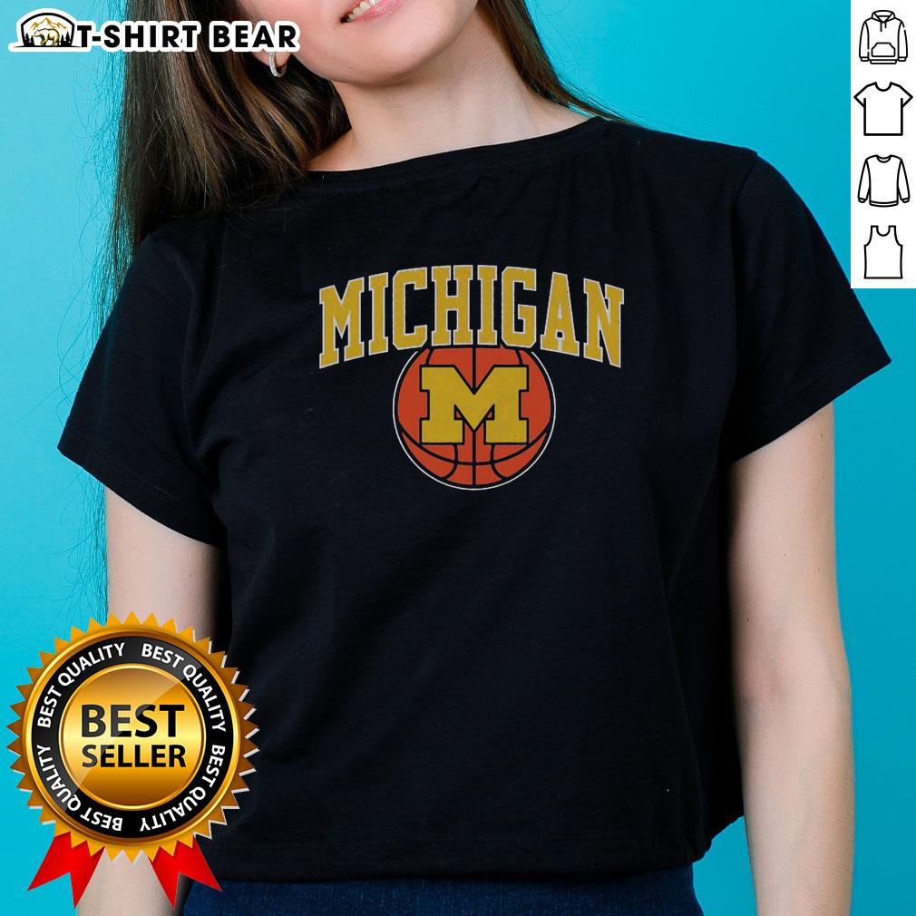 Top Michigan Basketball Vintage Ladies Tee Vintage ladies tee featuring Michigan basketball design, perfect for fans and stylish sportswear enthusiasts.