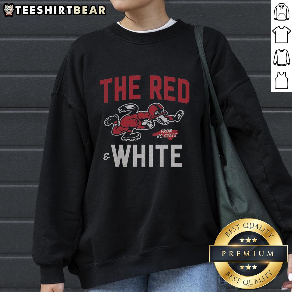 top-the-red-and-white-nc-state-football-sweatshirt Top the Red and White NC State football sweatshirt displayed on a hanger, showcasing team colors and logo.