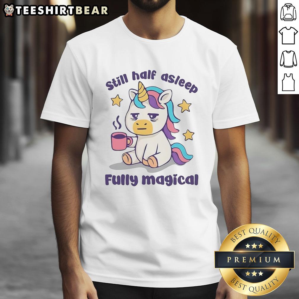 top-unicorn-holding-coffee-mug-still-half-asleep-fully-magical-t-shirt Top unicorn holding a coffee mug, looking half asleep, on a fully magical t-shirt design.