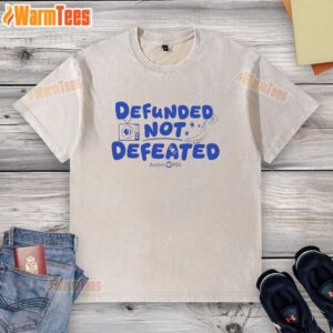 Premium defunded not defeated Austin PBS slogan washed t-shirt displayed on a neutral background, showcasing its design.
