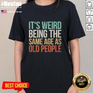 Vintage ladies tee featuring the phrase 'Good, Its Weird Being the Same Age as Old People' in playful typography.