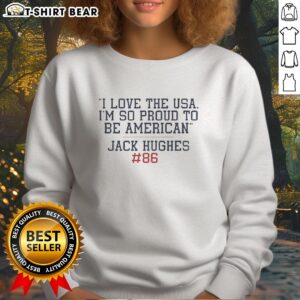Jack Hughes wearing an 'I Love the USA, I'm So Proud to Be American' sweatshirt, showcasing patriotism and style.