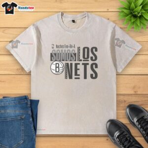 Official Brooklyn Nets NBA 2025 Noches Ene Be A Training Ornament Washed T-Shirt in black with logo design.