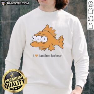 Alt Text: Cozy Good I Love Hamilton Harbour sweatshirt displayed on a wooden table, perfect for fans of Hamilton.