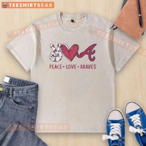 Alt Text: Official Atlanta Braves Peace Love Braves hand sign in heart shape on a washed t-shirt, showcasing team spirit.