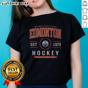 Original Edmonton Oilers Hockey Legacy Crest Ladies Tee showcasing the team's iconic logo and stylish design.