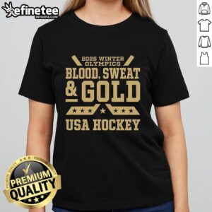 Official 2026 Winter Olympics USA Hockey ladies tee featuring bold 'Blood, Sweat, and Gold' design for fans.