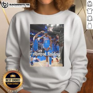 Shai Gilgeous-Alexander in an Oklahoma City Thunder sweatshirt after a game, showcasing team spirit and style.