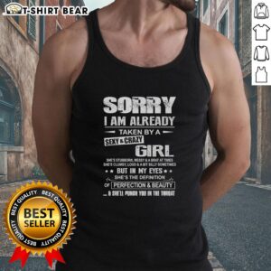 Person wearing a 'Sorry, I'm Already Taken by a Sexy and Crazy Girl' tank top, showcasing a fun and playful style.