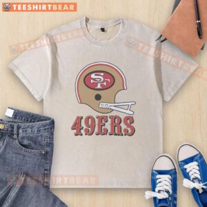 Alt Text: San Francisco 49ers football logo on a big helmet design featured on a washed t-shirt, perfect for fans.
