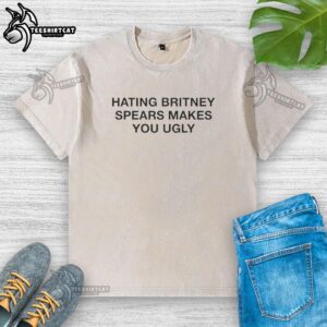 Nice Hating Britney Spears Makes You Ugly washed t-shirt displayed on a mannequin against a colorful backdrop.