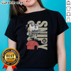 Snoopy the sniper and Woodstock sitting on a doghouse, featured on a ladies tee, perfect for Peanuts fans.