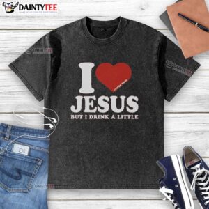 Alt Text: Official I Love Jesus But I Drink A Little washed t-shirt featuring a fun, faith-inspired design for casual wear.