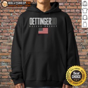 Alt Text: Jake Oettinger wearing a Dallas Stars hoodie with USA flag design, showcasing his team spirit and style.