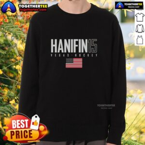 Alt Text: Noah Hanifin wearing a USA flag sweatshirt while supporting the Vegas Golden Knights at an event.
