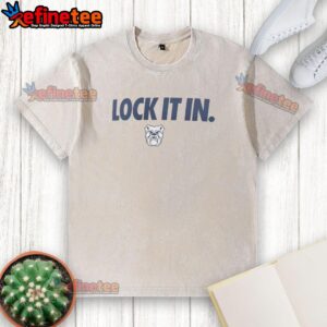 Alt Text: Hot Butler Bulldogs 2026 Lock It In washed t-shirt displayed on a hanger, showcasing vibrant team colors and logo.