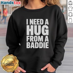 Alt Text: Official I Need A Hug From A Baddie Sweatshirt featuring bold text design in a cozy, stylish fit.