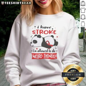 Cute panda in a red ribbon sweatshirt, showcasing its playful side with a funny pose and relaxed demeanor.