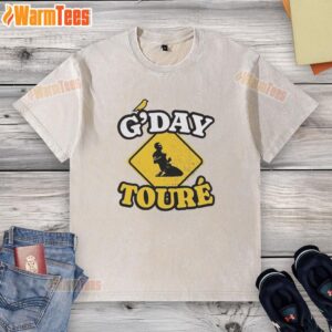 Awesome Mo Toure of Norwich City G'day Toure vintage washed t-shirt displayed on a wooden background.