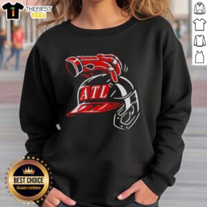 Alt Text: Stylish Atlanta Braves head scratch sweatshirt featuring team colors and logo, perfect for fans and casual wear.