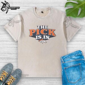 Alt Text: Premium Denver Broncos Pick Is In washed t-shirt featuring team colors and logo, perfect for fans and game day.