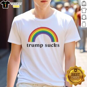Official Trump Sucks Rainbow Funny T-Shirt featuring colorful text and a humorous design for political satire enthusiasts.