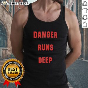 Model wearing a Nice Danger Runs Deep tank top, showcasing its stylish design and vibrant colors perfect for summer.
