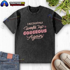 Alt Text: Official I Accidentally Woke Up Gorgeous Again washed t-shirt displayed on a hanger, showcasing its stylish design.