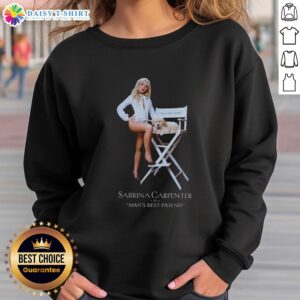 Sabrina Carpenter wearing a stylish 'Mans Best Friend' sweatshirt, showcasing her trendy fashion sense.