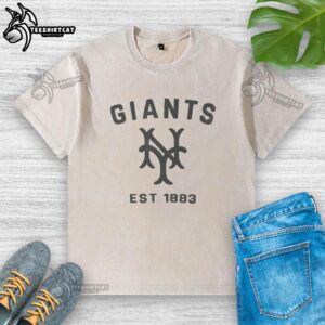 Alt Text: Original San Francisco Giants Cooperstown Duster Washed T-Shirt displayed on a wooden surface, showcasing its vintage design.