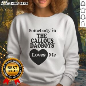 Nice Somebody In The Callous Daoboys Loves Me sweatshirt displayed on a hanger, showcasing its unique design and style.