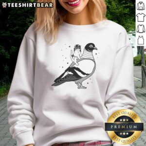 Top Gary riding pigeon cat in a hat flies on the back of a dove sweatshirt, showcasing whimsical pet fashion.
