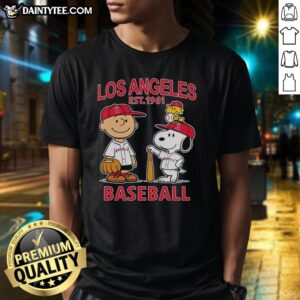 Alt Text: Charlie Brown, Snoopy, and Woodstock wearing Los Angeles Angels baseball jersey Est 1961 t-shirt design.