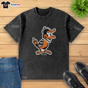 Alt Text: Nice Zay Flowers wearing a Baltimore Orioles mascot washed t-shirt, celebrating the team's legacy since 1954.