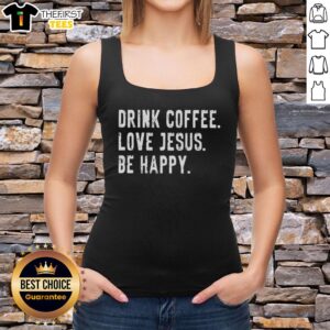 Person wearing a 'Nice Drink Coffee Love Jesus Be Happy' tank top, enjoying a sunny day with a cup of coffee.