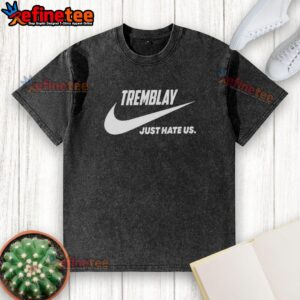 Alt Text: Official Tremblay Just Hate Us parody logo on a washed t-shirt, featuring a humorous design and relaxed fit.