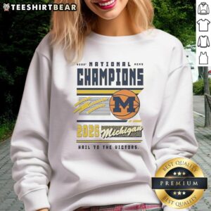 2026 NCAA Men's Basketball National Champions sweatshirt featuring Michigan Wolverines and 'Hail to the Victors' design.