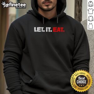Trevor Bauer wearing a Let It Eat hoodie, showcasing his casual style and passion for baseball in a vibrant setting.